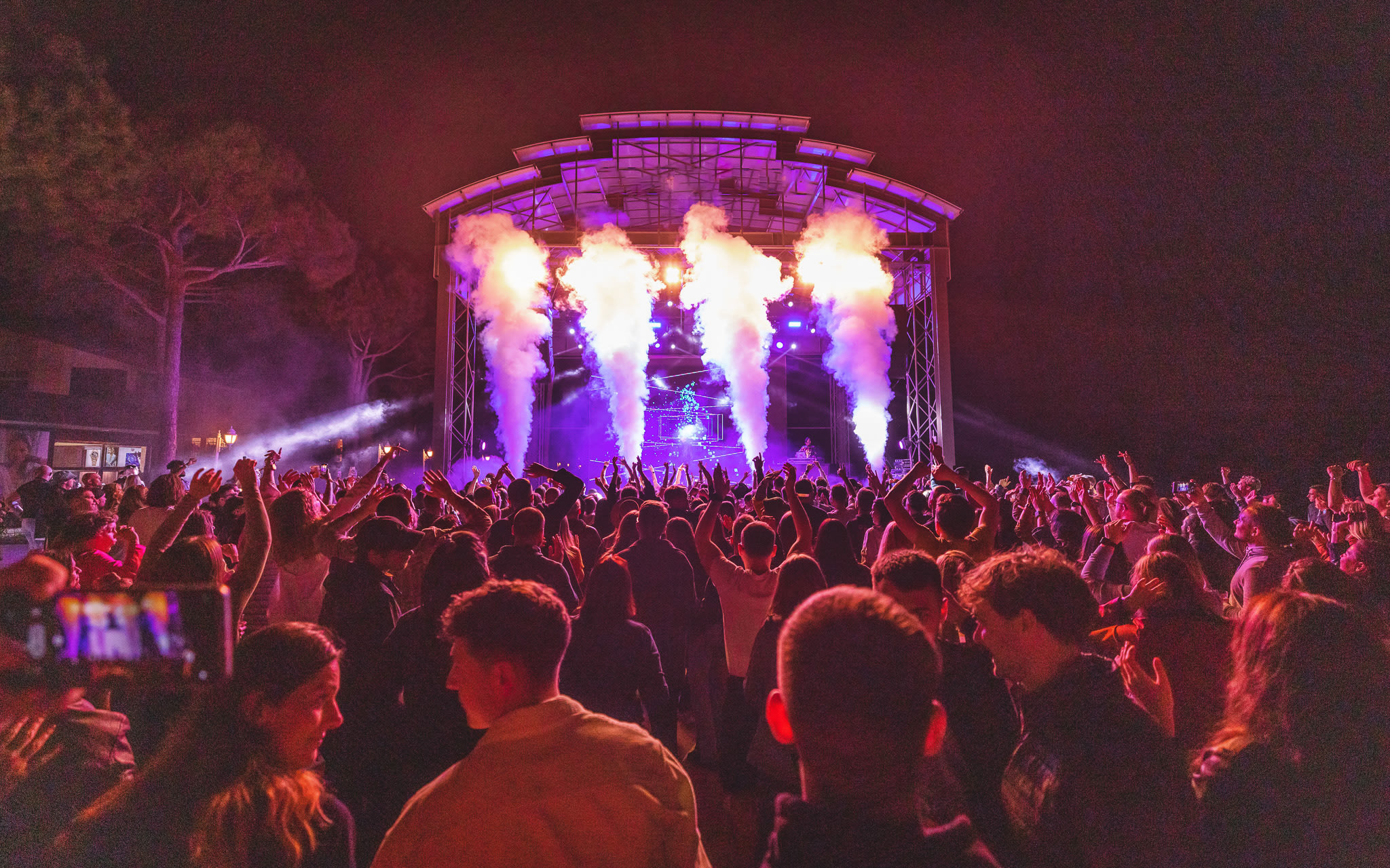 A crowd of people watching at the stage